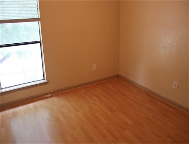 empty room with light wood-type flooring