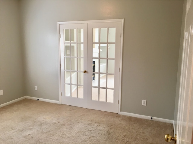 doorway to outside featuring french doors and carpet floors