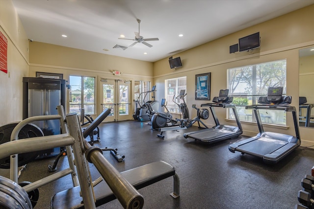 workout area featuring french doors, ceiling fan, and a healthy amount of sunlight