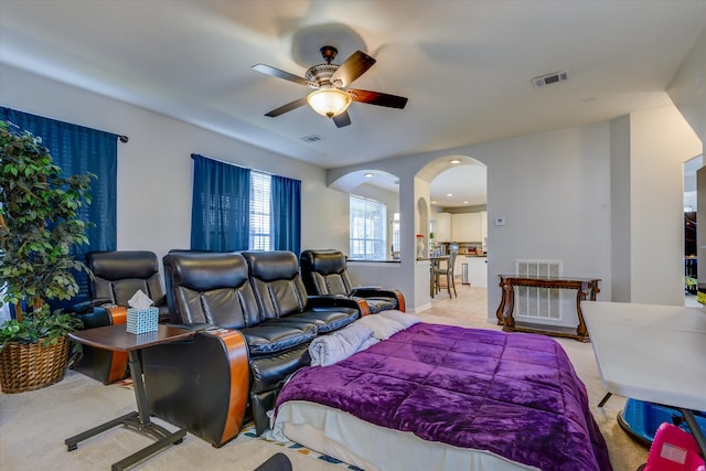 bedroom with light carpet and ceiling fan