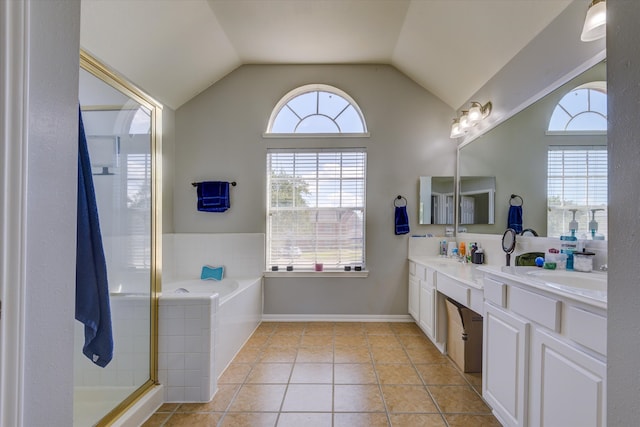 bathroom with vanity, vaulted ceiling, tile patterned floors, and separate shower and tub