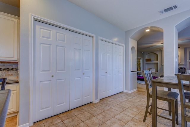 dining space with ceiling fan and light tile patterned floors