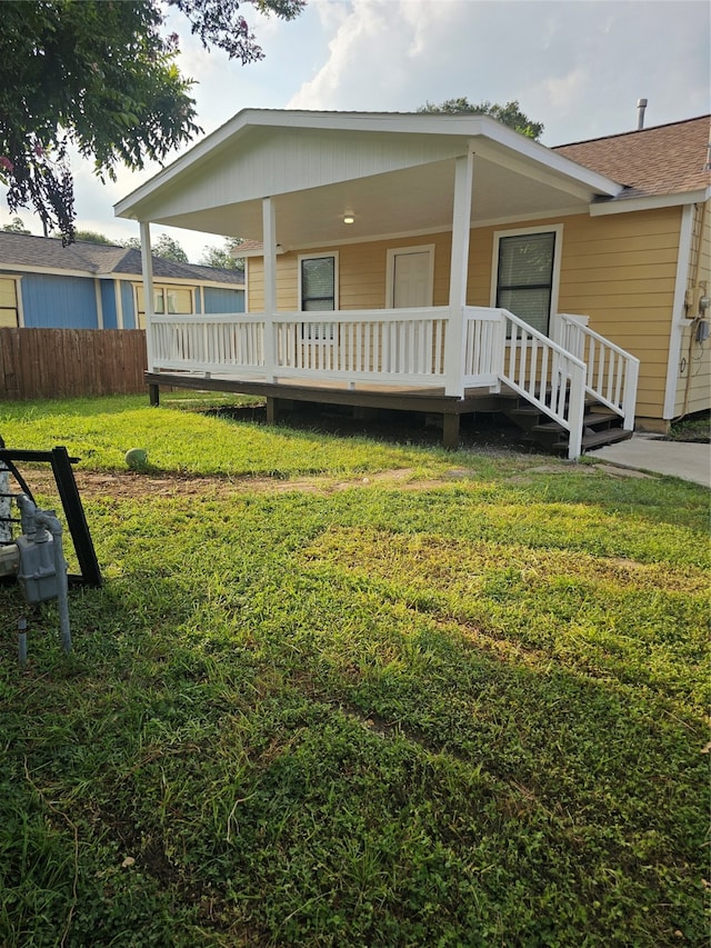 exterior space featuring a porch and a front lawn