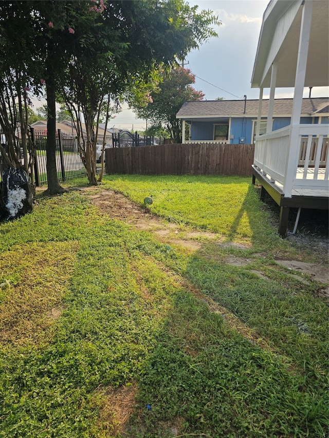 view of yard featuring a wooden deck