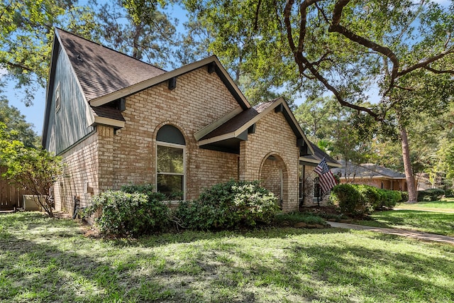 view of property exterior with a yard