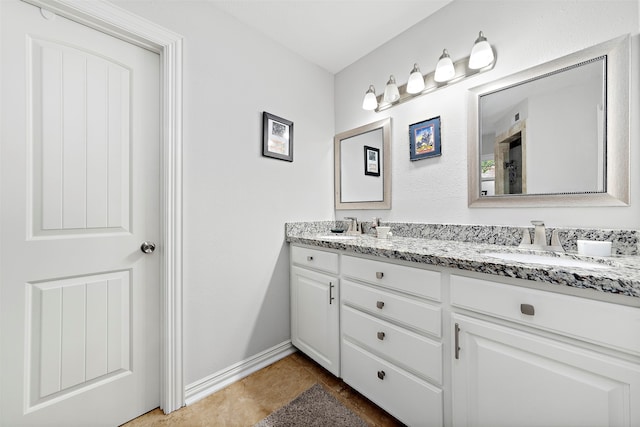 bathroom featuring tile patterned flooring and vanity