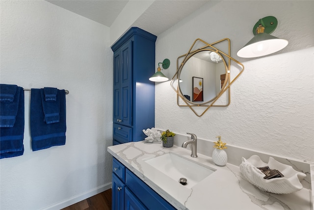 bathroom featuring vanity and hardwood / wood-style floors