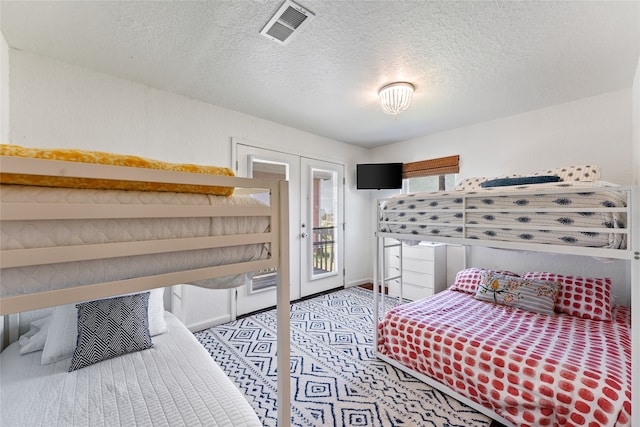 bedroom featuring a textured ceiling