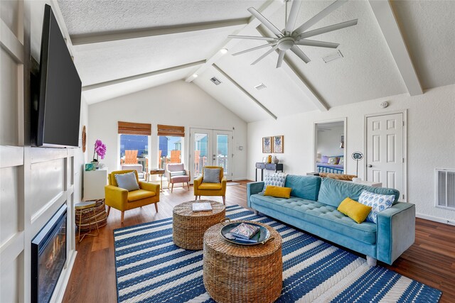 living room featuring a textured ceiling, vaulted ceiling with beams, dark hardwood / wood-style floors, and ceiling fan