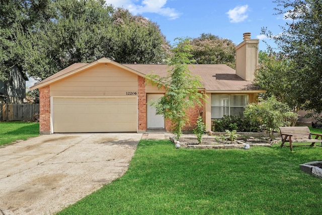 single story home with a garage and a front lawn