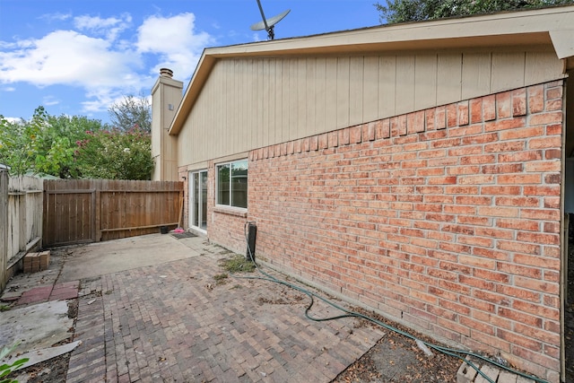 view of home's exterior with a patio area