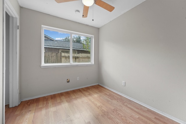 empty room with ceiling fan and light wood-type flooring