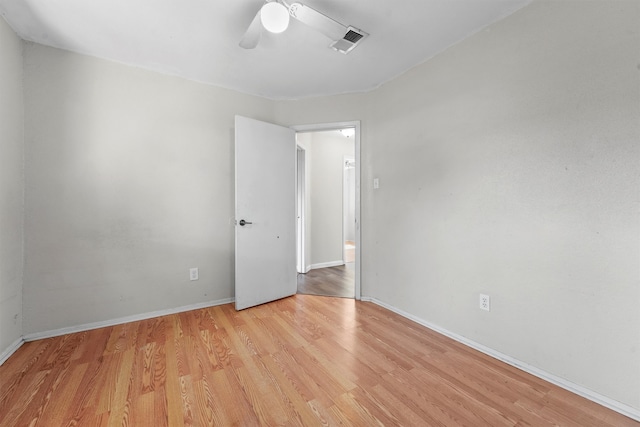 spare room featuring ceiling fan and light wood-type flooring