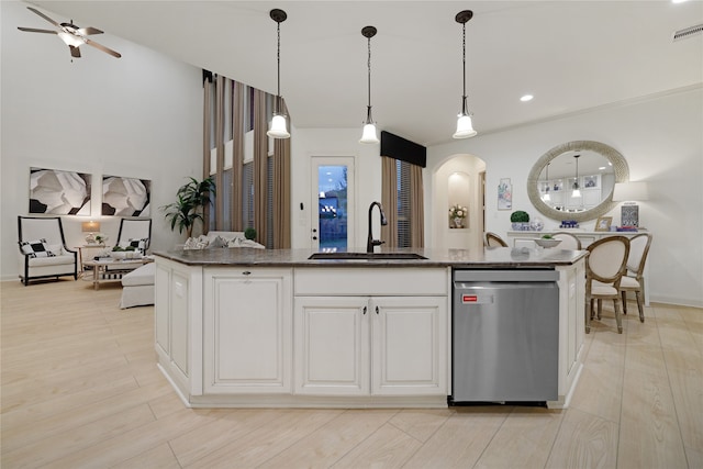 kitchen with light hardwood / wood-style floors, sink, decorative light fixtures, ceiling fan, and stainless steel dishwasher