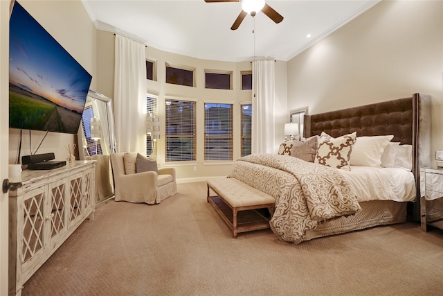 bedroom with carpet, ornamental molding, and ceiling fan