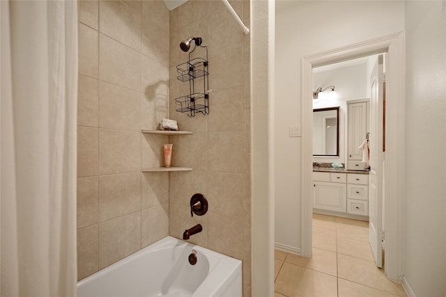 bathroom with vanity, tile patterned floors, and tiled shower / bath