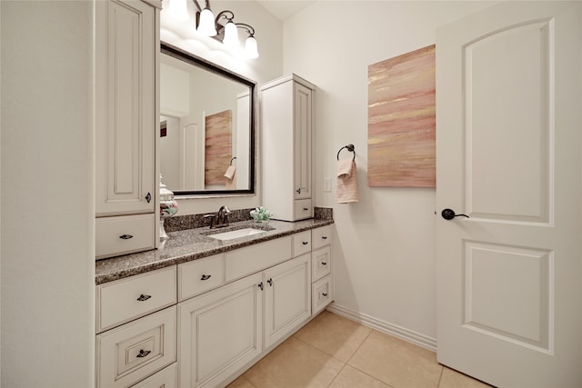 bathroom with tile patterned flooring and vanity