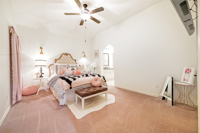 bedroom featuring light carpet, lofted ceiling, and ceiling fan