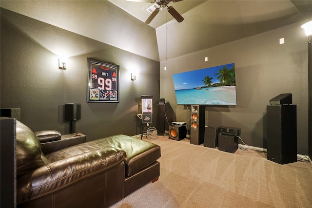 home theater featuring ceiling fan, light colored carpet, and lofted ceiling