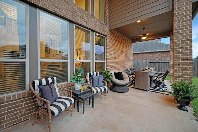 view of patio with outdoor lounge area and ceiling fan