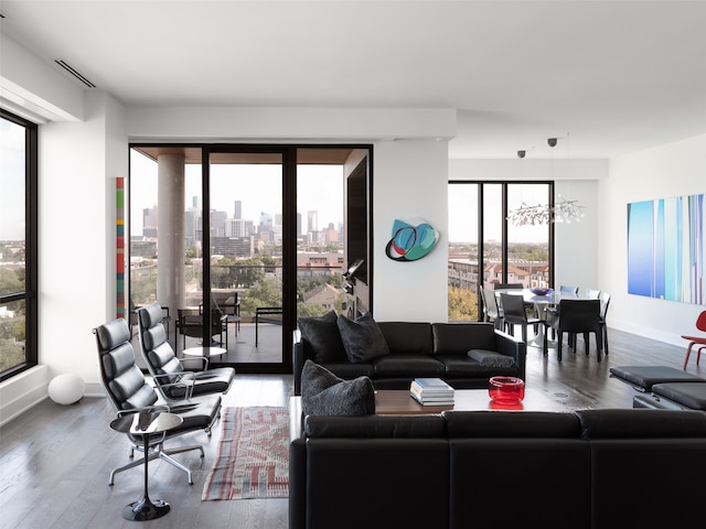 living room with plenty of natural light and hardwood / wood-style floors