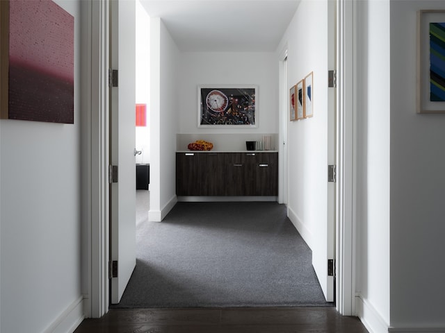 hallway featuring dark hardwood / wood-style floors