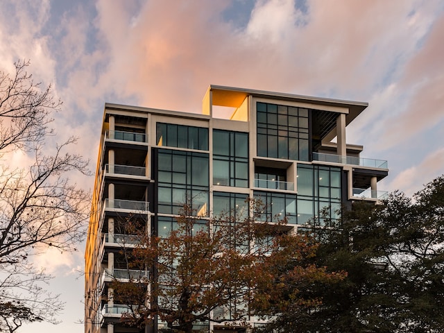 view of outdoor building at dusk