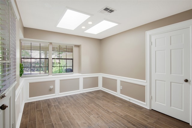 unfurnished room featuring wood-type flooring