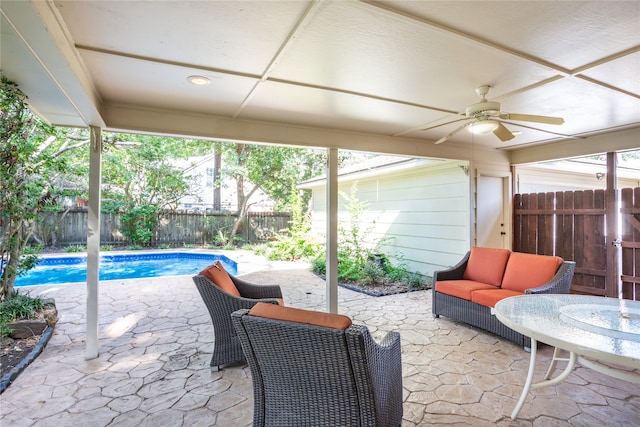 exterior space with a fenced in pool, outdoor lounge area, and ceiling fan