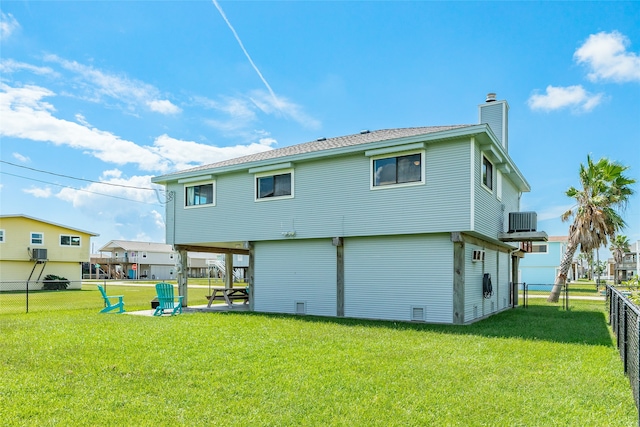 back of property featuring a lawn, a patio area, and central air condition unit