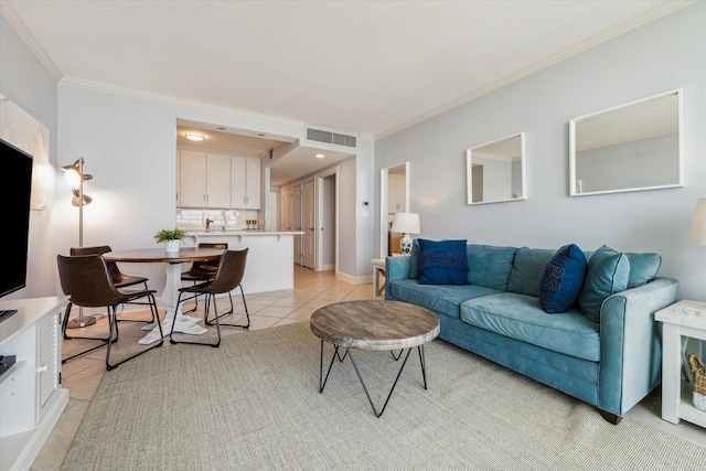 living room featuring light tile patterned flooring and ornamental molding