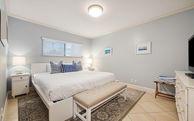 bedroom with light tile patterned floors and ornamental molding