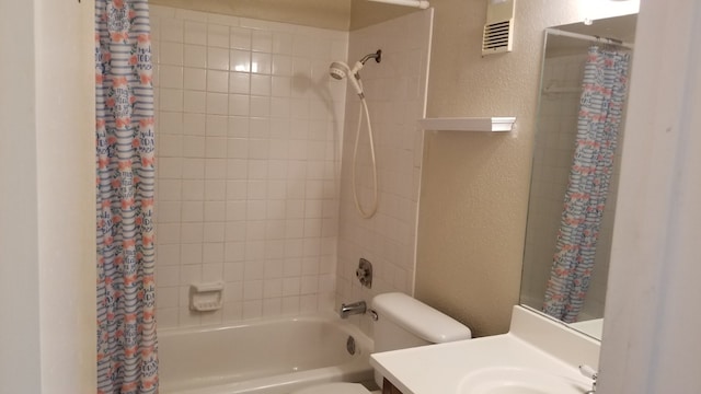 full bathroom featuring shower / tub combo, vanity, and toilet