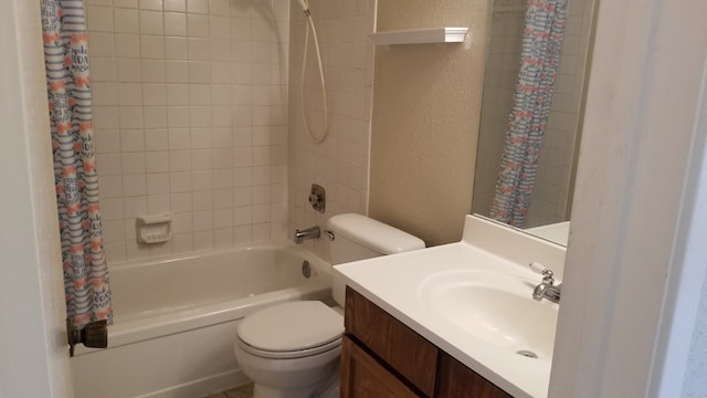 full bathroom featuring vanity, shower / bath combo with shower curtain, and toilet