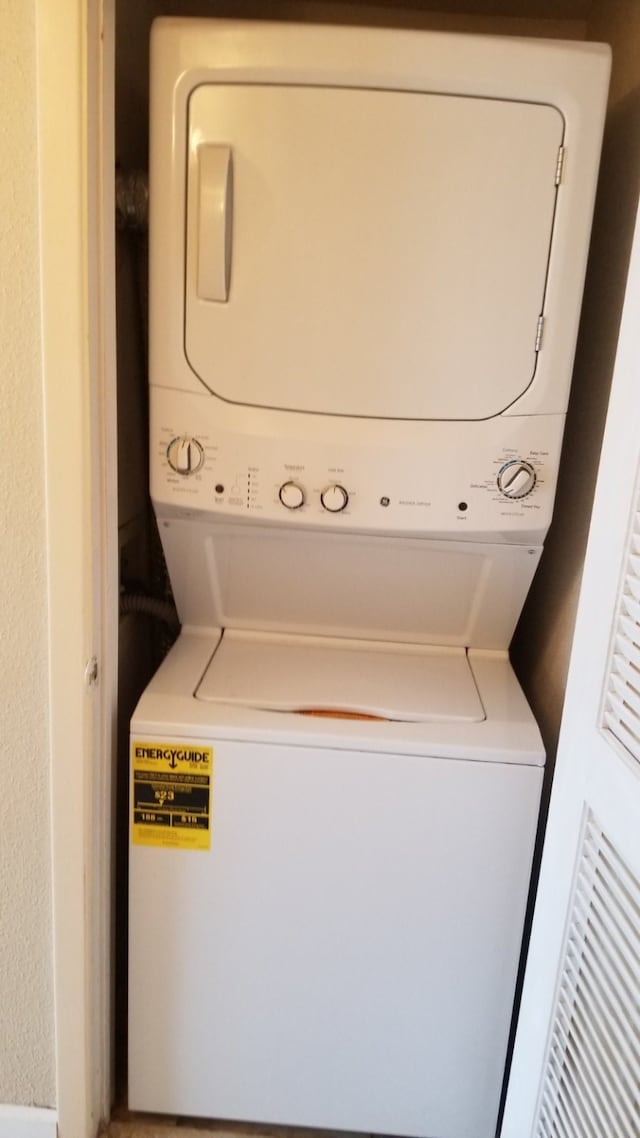 laundry room featuring stacked washing maching and dryer