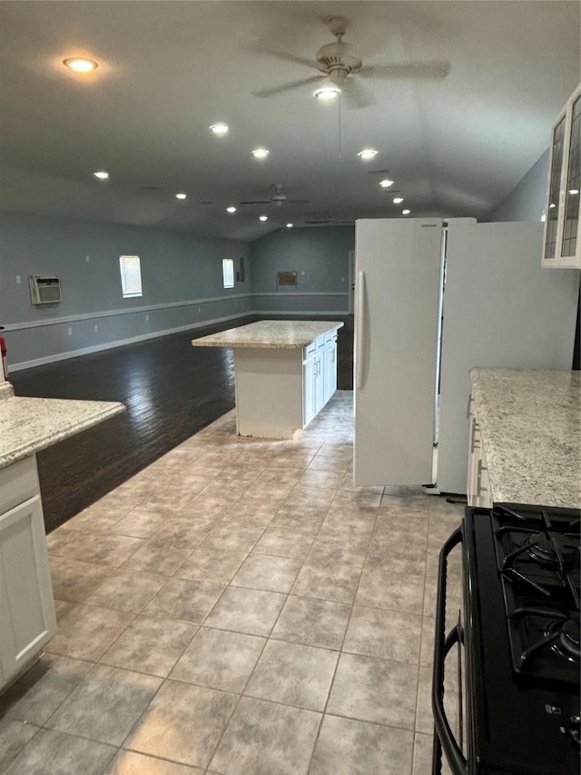 kitchen with a ceiling fan, recessed lighting, white cabinets, and black gas range