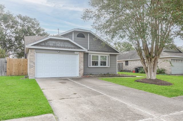 view of front facade with a front lawn and a garage