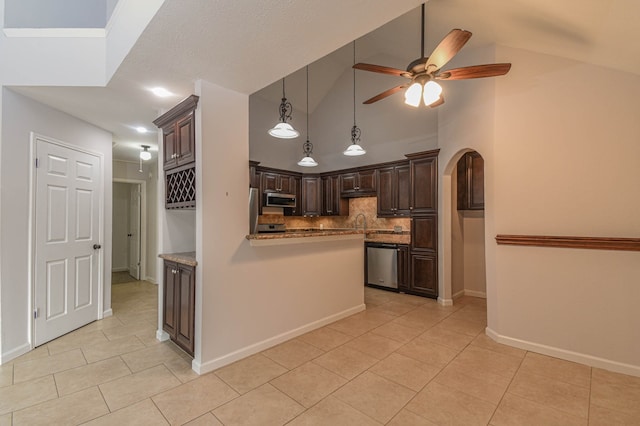 kitchen with backsplash, light tile patterned floors, stainless steel appliances, ceiling fan, and dark brown cabinetry