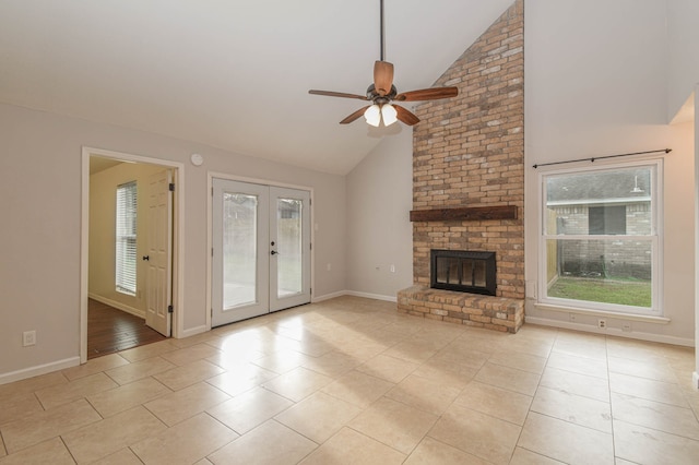 unfurnished living room featuring ceiling fan, a brick fireplace, light tile patterned floors, and high vaulted ceiling