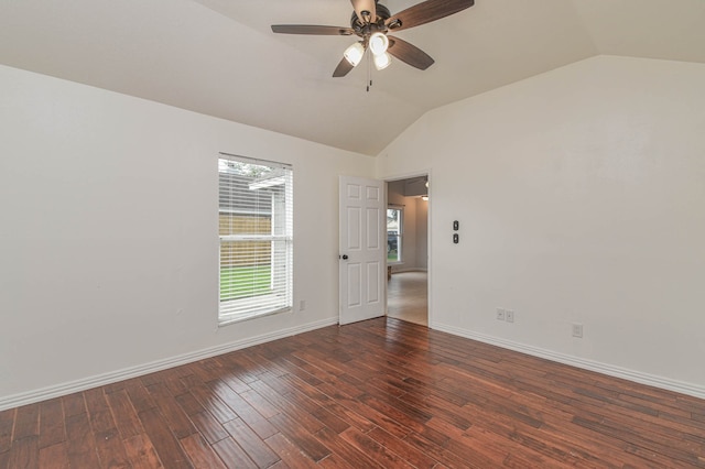 spare room featuring ceiling fan, lofted ceiling, and dark hardwood / wood-style floors