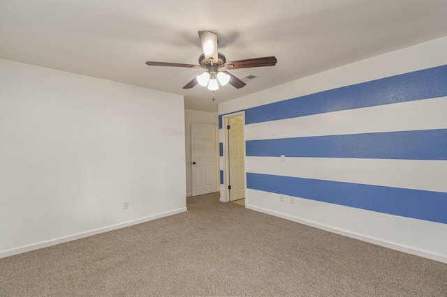 carpeted empty room with ceiling fan