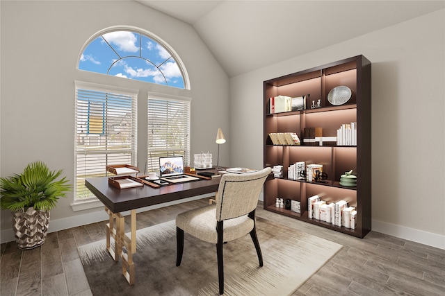 office area featuring vaulted ceiling and hardwood / wood-style floors