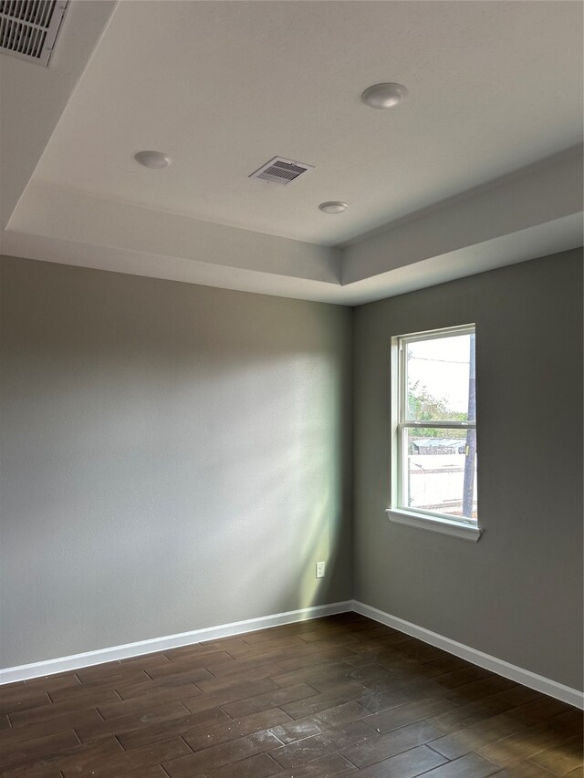 unfurnished room with dark hardwood / wood-style floors