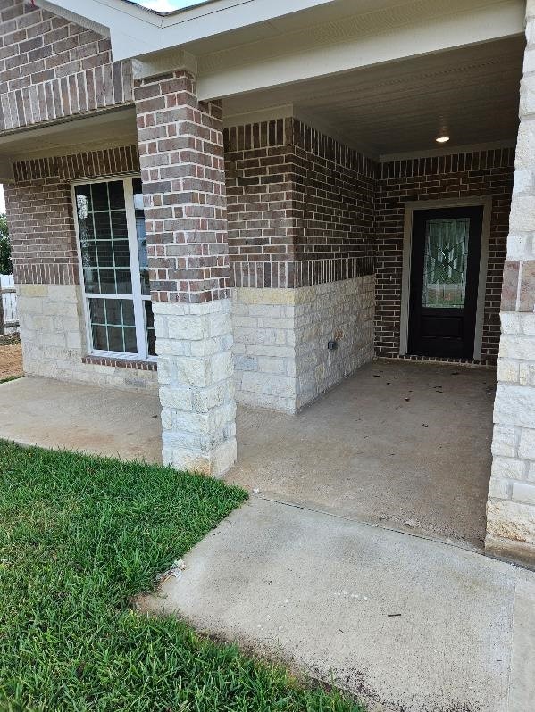 entrance to property with a patio area