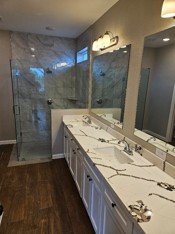 bathroom featuring vanity, hardwood / wood-style flooring, and separate shower and tub