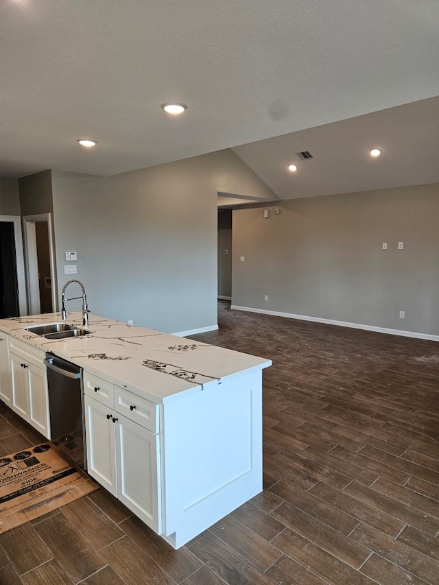 kitchen with dishwasher, white cabinets, sink, an island with sink, and dark hardwood / wood-style floors