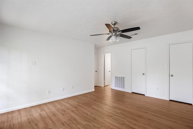 unfurnished bedroom featuring hardwood / wood-style flooring and ceiling fan