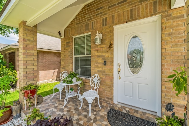 entrance to property featuring covered porch