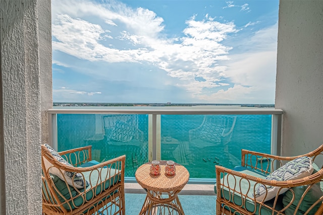 balcony featuring a water view