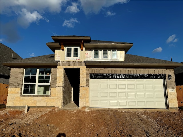 view of front of property featuring a garage